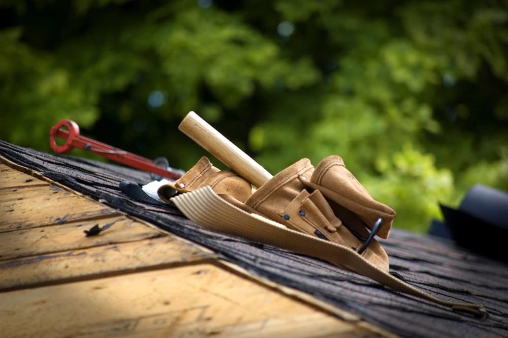 Roofing tools on asphalt shingles